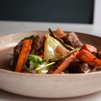 Savor this mouth-watering beef and vegetable stew featuring tender meat and vibrant root vegetables.